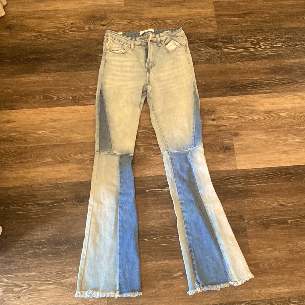 bell bottom blue miss matched patched jeans.